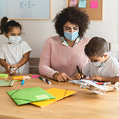 Childcare worker with young children