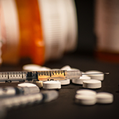 syringe and pills